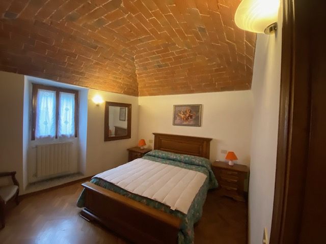 Camera con soffitto a volta in mattoni